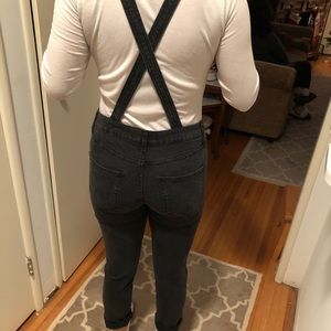 Distressed black denim overalls